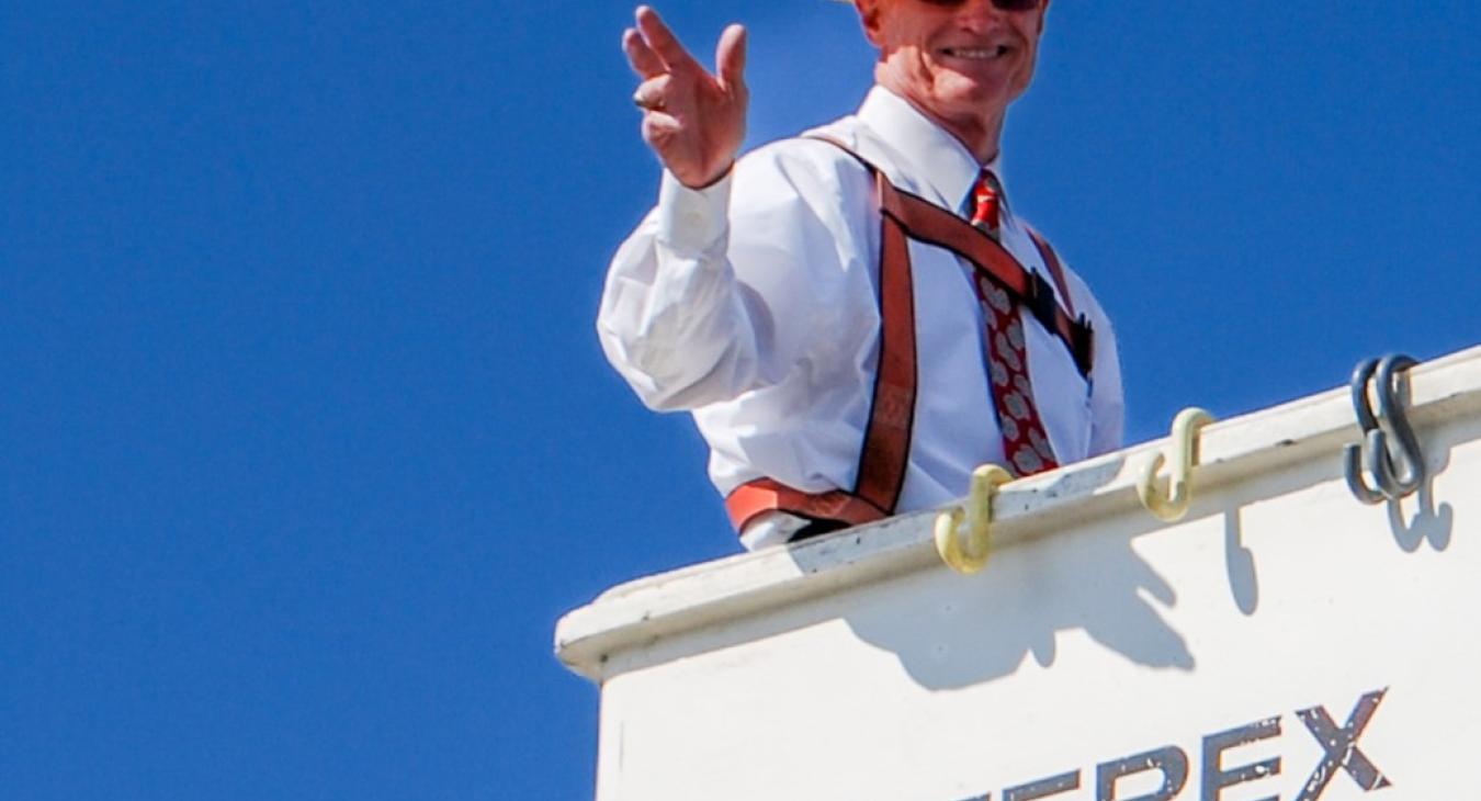 Kelley Smith goes up in a bucket truck following an Annual Meeting gathering in this file photo.