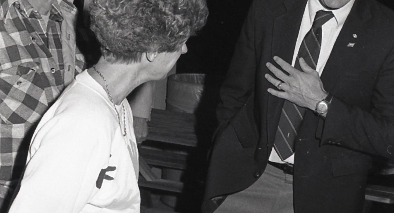 Kelley Smith shares a laugh with a member during an Annual Meeting gathering in this file photo.